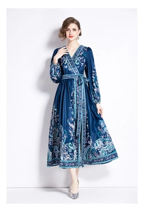 Close-up of V-neck wrap dress with paisley floral print and adjustable drawstring waist
