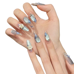 Handmade press-on nails with blue cat-eye gradient, 3D floral carving and pearls