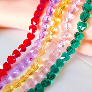 Close-up of faceted crystal heart beads in red, purple, yellow, pink and green
