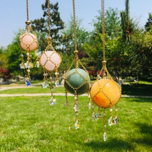 Hanging crystal ball net cages in silver and gold mesh with delicate star pendants