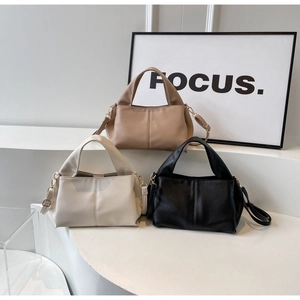Three minimalist tote bags in khaki, beige and black with lychee texture leather detail