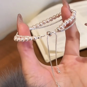 Detail of double-layer bracelet with pearls, crystals and adjustable slider clasp