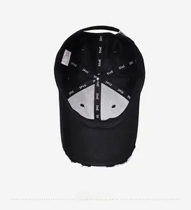 Detail view of the distressed vintage baseball cap interior with embroidered straps and label