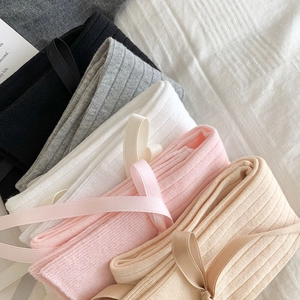 Close-up of ribbed cotton socks in five colors with cute ribbon bow detail