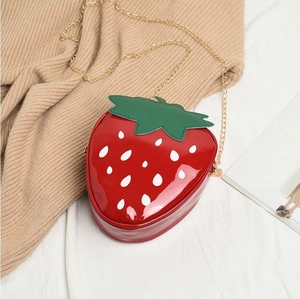 Cute strawberry-shaped patent leather crossbody bag with green leaf and gold chain strap