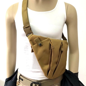 Close-up of khaki tactical shoulder bag with durable nylon material on a model