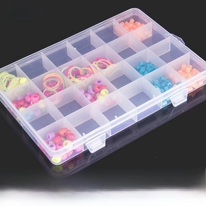 Detailed view of clear 24-grid plastic organizer box filled with colorful beads