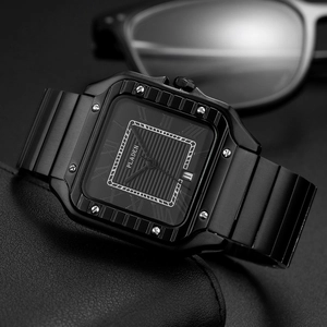 Macro detail of square black quartz watch with Roman numerals and date window