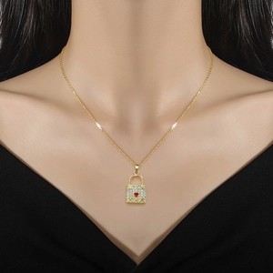 Minimalist gold titanium steel necklace with heart lock pendant and small diamonds on model