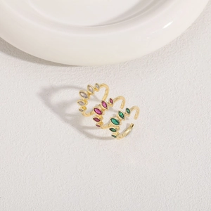 Detailed view of three 14K gold-plated rings with colorful marquise-cut zircon stones