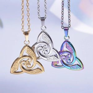 Three witch knot necklaces in gold, silver, and rainbow steel with triskelion detail