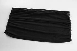 Detail of sheer black mesh fabric featuring delicate pleated folds and transparent texture
