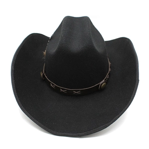 Detail of black wool cowboy hat with brown leather band and decorative metal studs
