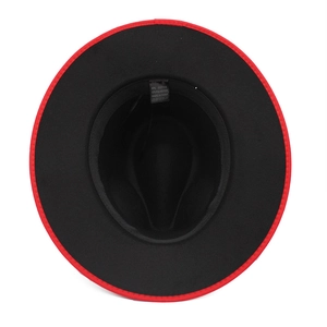 Detail of red and black felt fedora hat interior showing cotton blend fabric and care label
