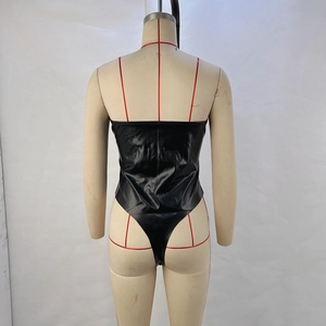 Detail of black glossy PU leather bodysuit showing back lace-up design on mannequin
