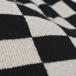 Thick black and white checkerboard knit beanie hat for winter outdoor warmth
