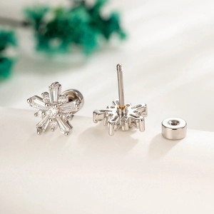Micro-inlaid zircon snowflake stud earrings with screw-back closures in silver finish