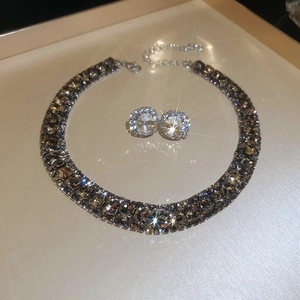 Detail of square zircon jewelry set featuring brown gems and rhinestone halo