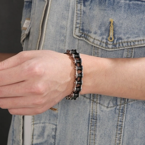 Close-up of 11mm silver and black bicycle chain bracelet on a man's wrist