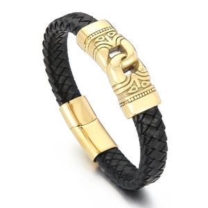 Men's braided leather bracelet with golden engraved metal clasp on white background