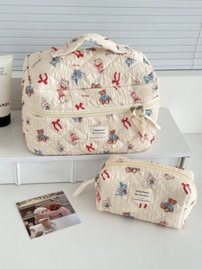Quilted makeup bag set with cartoon bear and rabbit prints in a soft cream finish
