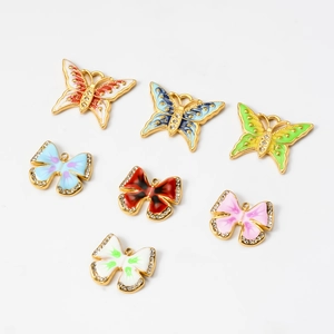 Macro view of colorful enamel butterfly pendants with crystal zircon edges for jewelry making