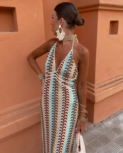 Detailed view of the multicolor wavy crochet knit pattern on a slim-fit halter dress