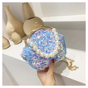 Detail of pink and blue sequin shell bag with large pearl handle and gold chain strap
