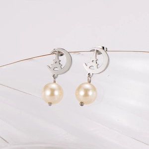Elegant stainless steel crescent moon earrings with Eiffel Tower carving and pearl drops