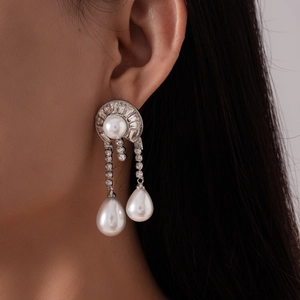 Elegant silver-tone drop earrings with geometric pearls and sparkling crystal tassels