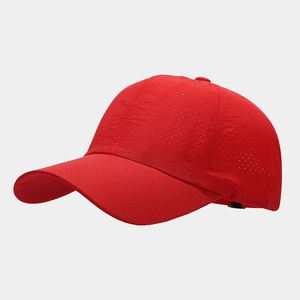 Detailed macro shot of the breathable red mesh fabric on this athletic baseball cap