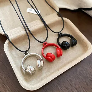 Minimalist headset pendant necklace set with silver, red, and black finishes on cords
