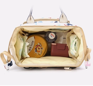 Detailed wide-open view of large capacity diaper backpack with internal storage compartments