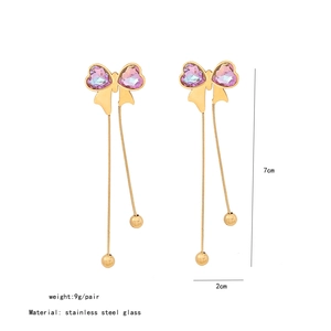 Detail shot of long tassel earrings with purple heart crystals and stainless steel beads