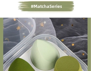 Close-up of soft matcha green makeup sponge set with storage box and mesh background