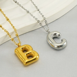 Balloon style letter B and C pendants in gold and silver stainless steel with fine chains