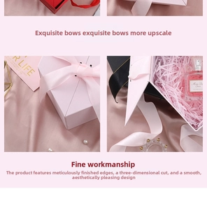 Detailed view of luxury heart-shaped gift boxes with silk bows and raffia paper filler
