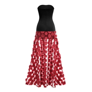 Detail of red mesh skirt with 3D polka dot textures and black strapless bodice