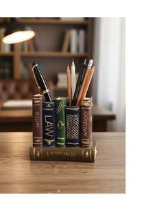 Detail of vintage book-shaped resin pen holder with gold embossed history and law text