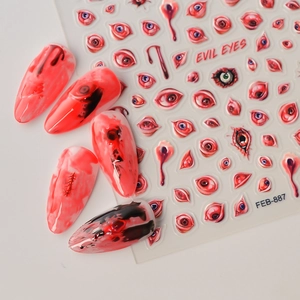 Macro view of 5D embossed evil eyes and blood drip stickers for Halloween nail art