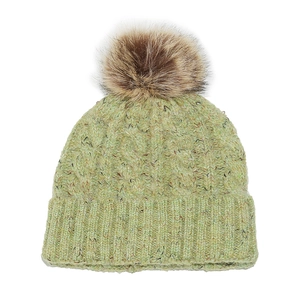Detailed knit texture of light green cable-knit beanie with brown faux fur pom-pom