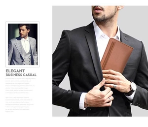 Slim brown leather business wallet being placed into a suit jacket inner pocket