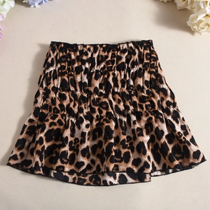 Detail of leopard print mini skirt featuring tiered ruffles and elastic high waistband
