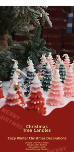 Detailed close-up of Christmas tree scented candles with festive bells and pine branches