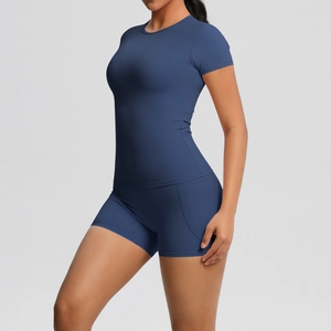 Detail of navy blue two-piece yoga set featuring slim fit t-shirt and high waist shorts