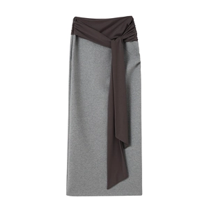 Detail of grey knitted midi skirt with coffee brown twisted tie waist design on white back