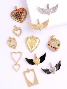 Detailed view of assorted heart-shaped gold plated micro-pave cubic zirconia jewelry pendants