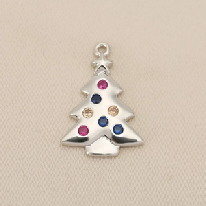 Detailed view of silver Christmas tree pendant with pink and blue zircon gemstones