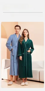 Detail of absorbent long-sleeved bathrobes with contrast white trim and waist tie belts