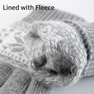 Winter thermal grey knitted gloves with white snowflake pattern and soft fleece lining